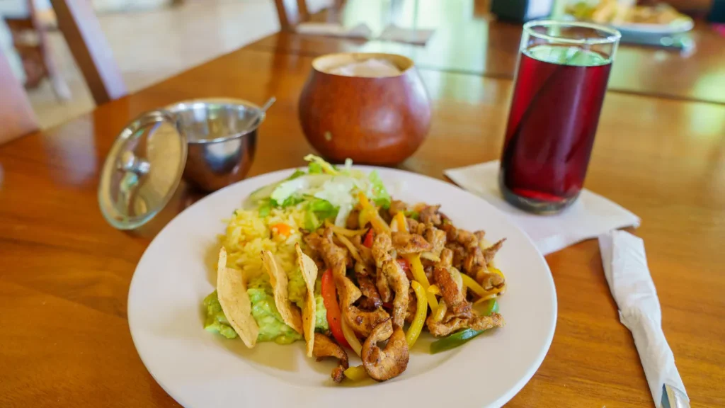 Chicken fajita tacos with a glass of hibiscus water at the palapa
