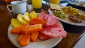 Breakfast plate with eggs, beans and fresh fruit at the cooperative palapa